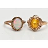 TWO YELLOW METAL RINGS, to include a 9ct gold opal single stone ring set with an oval opal