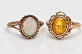 TWO YELLOW METAL RINGS, to include a 9ct gold opal single stone ring set with an oval opal