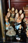 FOUR LARGE PENDELPHIN RABBITS AND ONE OTHER PENDELFIN ITEM, comprising a Mouse House match holder,