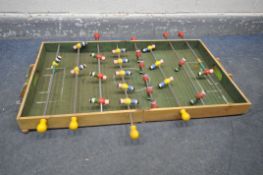 A VINTAGE FOLDING FOOTBALL GAMES TABLE, open length 100cm x depth 60cm (condition:-well used