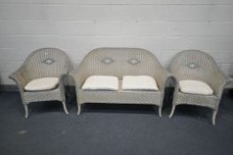 A WICKER THREE PIECE CONSERVATORY SUITE, comprising a sofa and a pair of armchairs (condition:-dirty