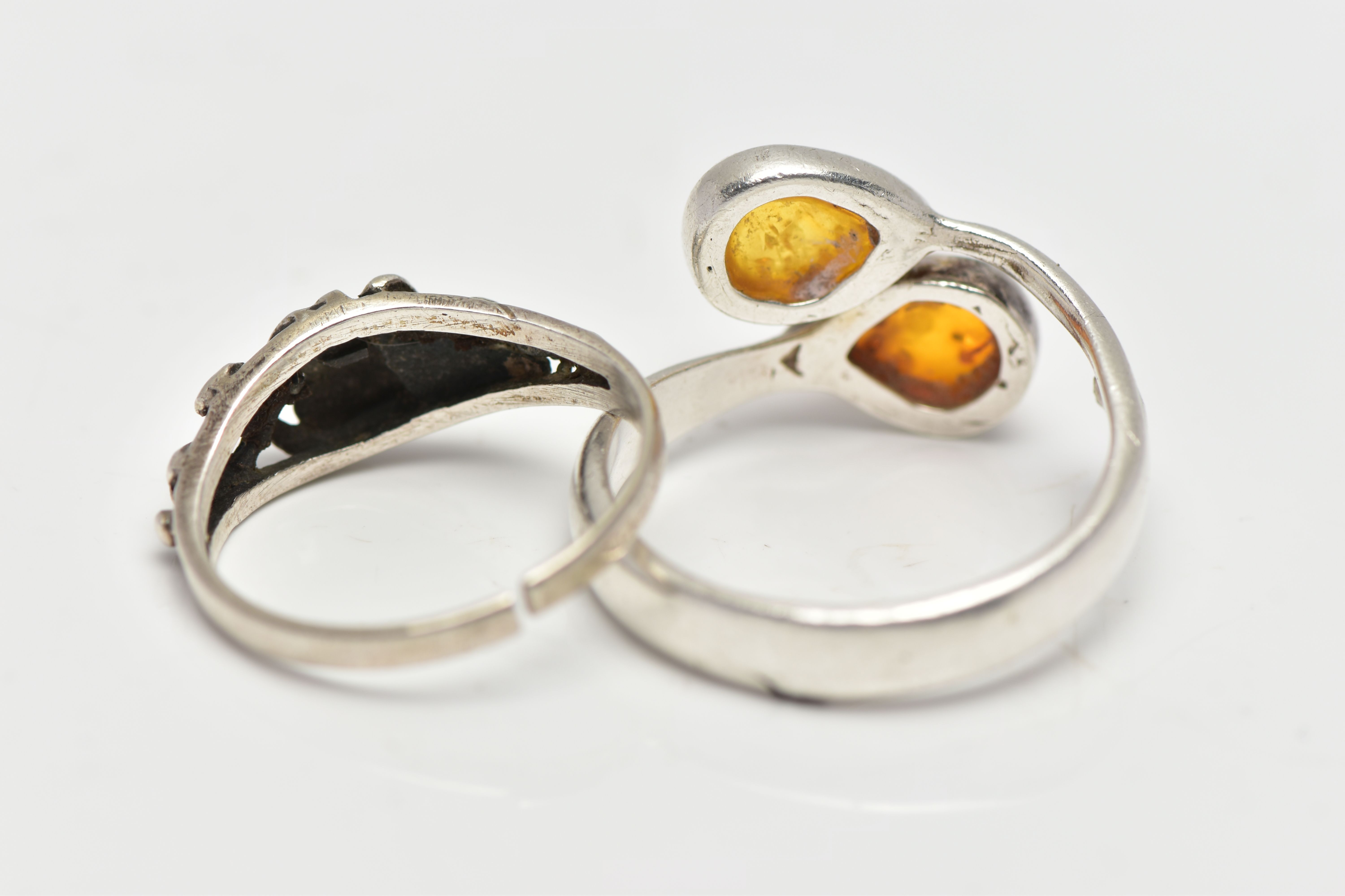 TWO WHITE METAL RINGS, the first of asymmetric design set with two pear copal resin cabochons, - Image 3 of 3
