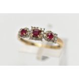 A 9CT GOLD RUBY AND DIAMOND RING, designed as three clusters, the centrally cluster set with a