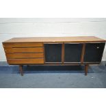 A MID-CENTURY TEAK SIDEBOARD, with four drawers, half of the top drawer with green baize lining