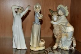 THREE LLADRO AND NAO FIGURES, comprising a Lladro 'Platero and Marcelino' figure depicting a boy