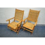 TWO FOLDING TEAK FOLDING ARMCHAIRS, with a rattan seat and back