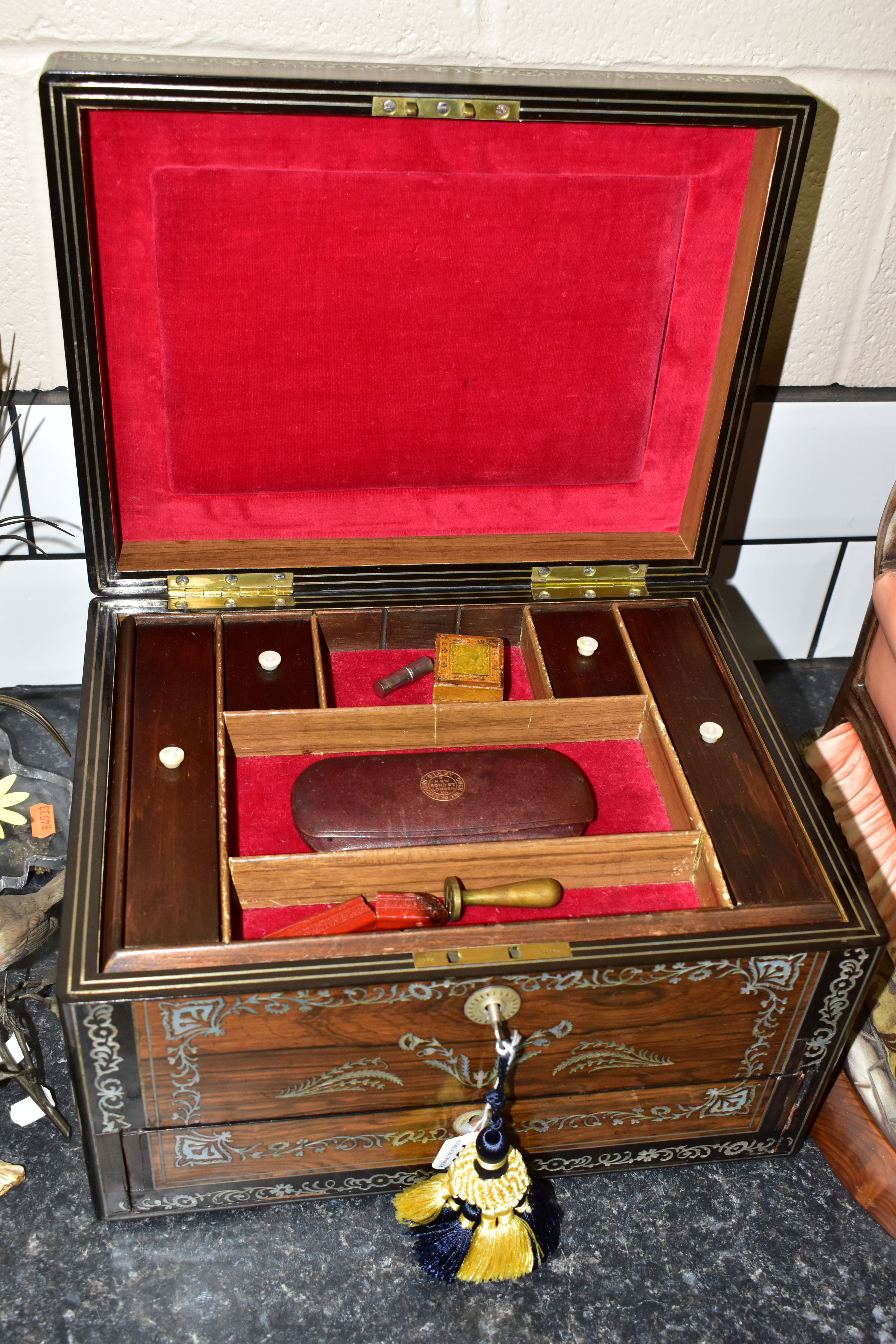 A MID- VICTORIAN WRITING ROSEWOOD WRITING BOX, INLAID WITH MOTHER OF PEARL DECORATED IN SCROLL AND