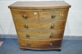 A GEORGIAN WALNUT AND CROSSBADED BOWFRONT CHEST OF TWO SHORT AND THREE LONG GRADUATED DRAWERS, on