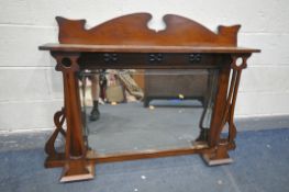 AN ARTS AND CRAFTS WALNUT OVERMANTEL MIRROR, with a shelf supported on a shaped uprights, and a