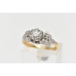 A MID 20TH CENTURY DIAMOND SINGLE STONE RING, set with a round brilliant cut diamond, within an