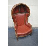 A 20TH CENTURY STAINED WOOD PORTERS CHAIR, with burgundy leather and studs that's bordering, width