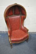 A 20TH CENTURY STAINED WOOD PORTERS CHAIR, with burgundy leather and studs that's bordering, width