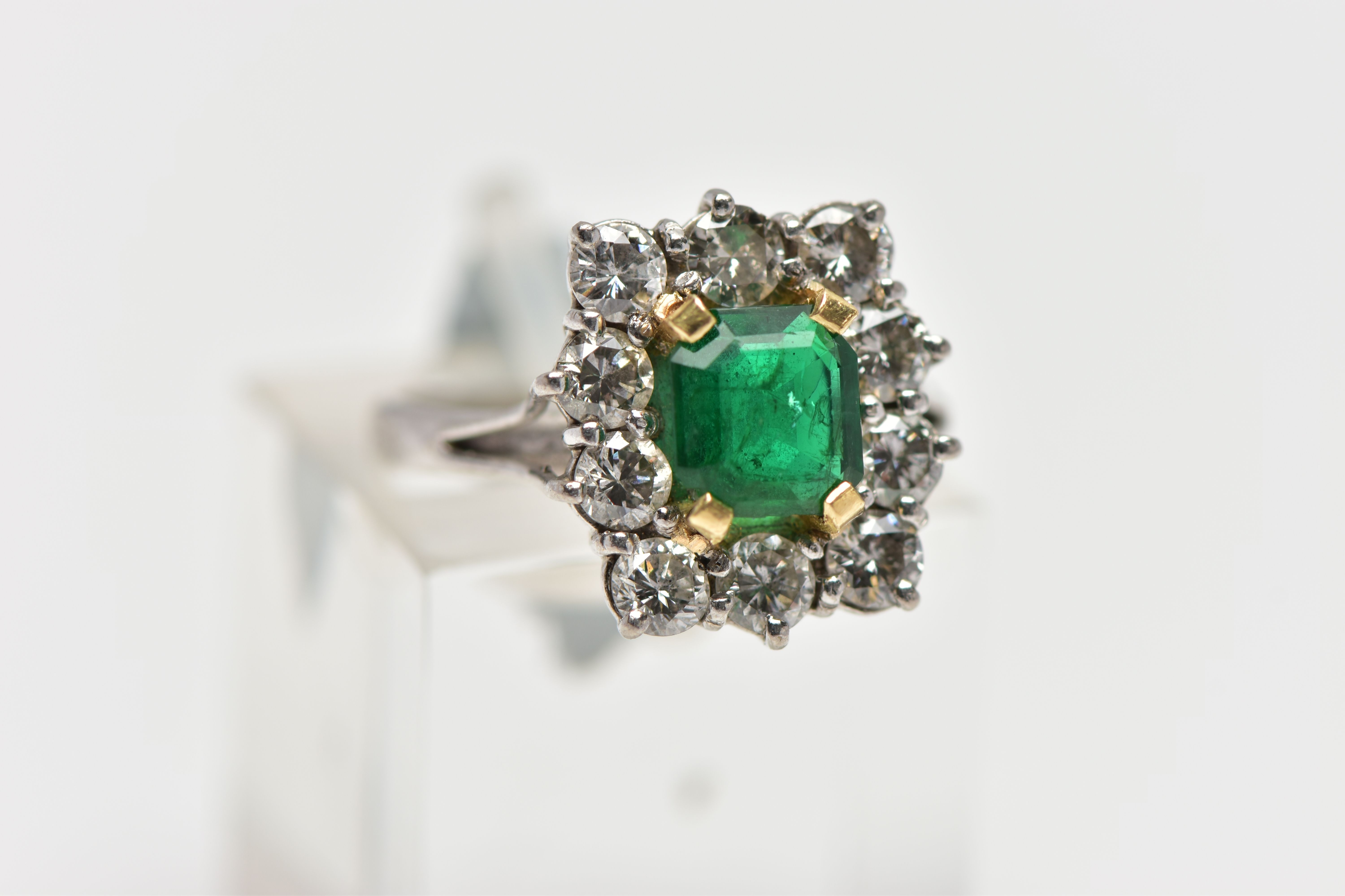 AN 18CT WHITE AND YELLOW GOLD EMERALD AND DIAMOND CLUSTER RING, the rectangular cut emerald, - Image 4 of 4