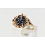 A 9CT GOLD SAPPHIRE CLUSTER RING, flower shape cluster set with seven circular cut deep blue
