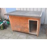 A LARGE DOG/ANIMAL KENNEL with sloping felt roof, wooden ship lap construction and an open door