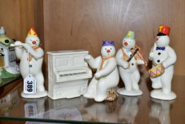 A GROUP OF FOUR ROYAL DOULTON 'THE SNOWMAN GIFT COLLECTION' FIGURES AND MATCHING PIANO, comprising