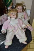 THREE PORCELAIN DOLLS, comprising two large Leonardo Collection baby girl dolls, height 55cm (one