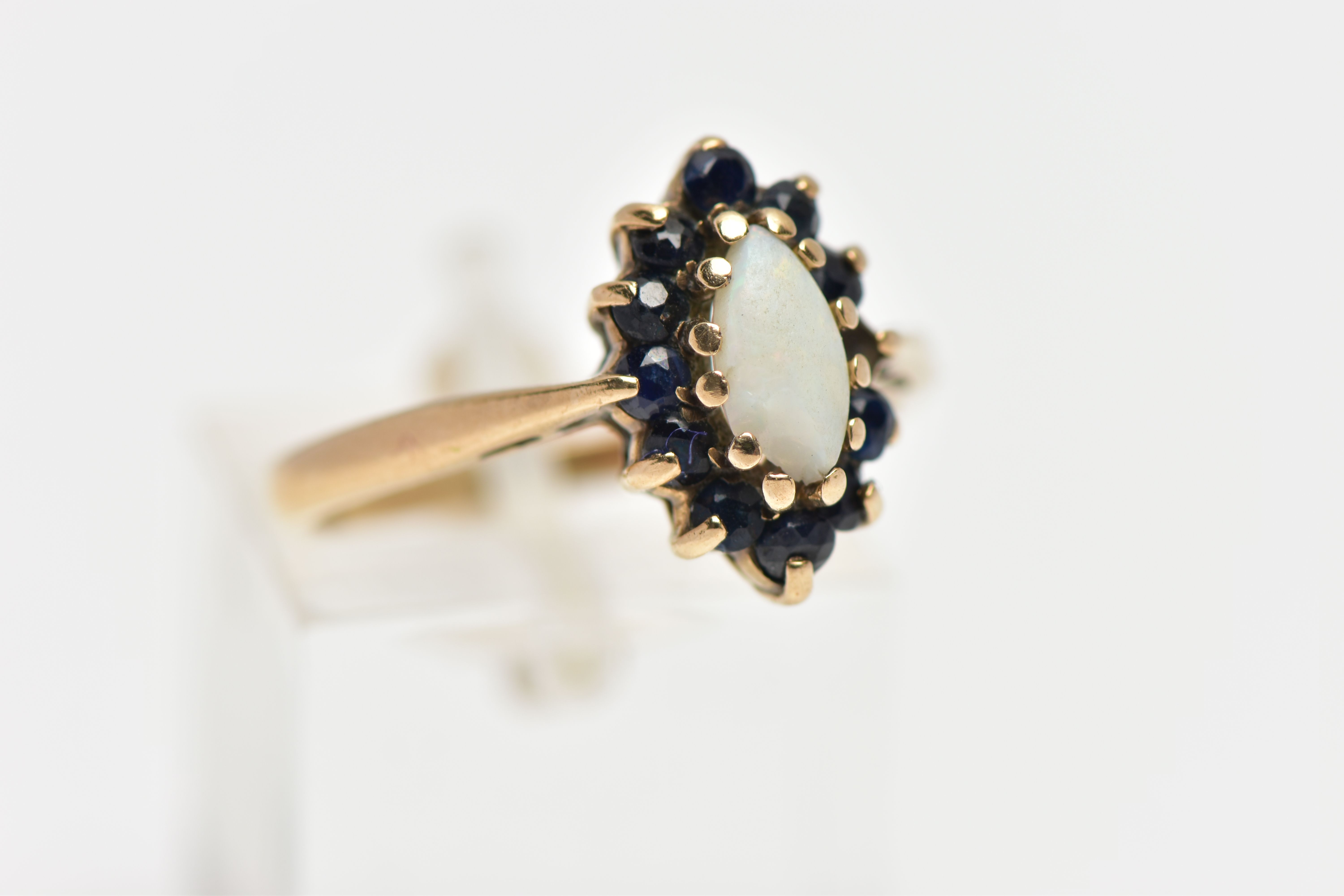 A 9CT GOLD OPAL AND SAPPHIRE CLUSTER RING, the marquise opal cabochon, with circular cut sapphire - Image 4 of 4