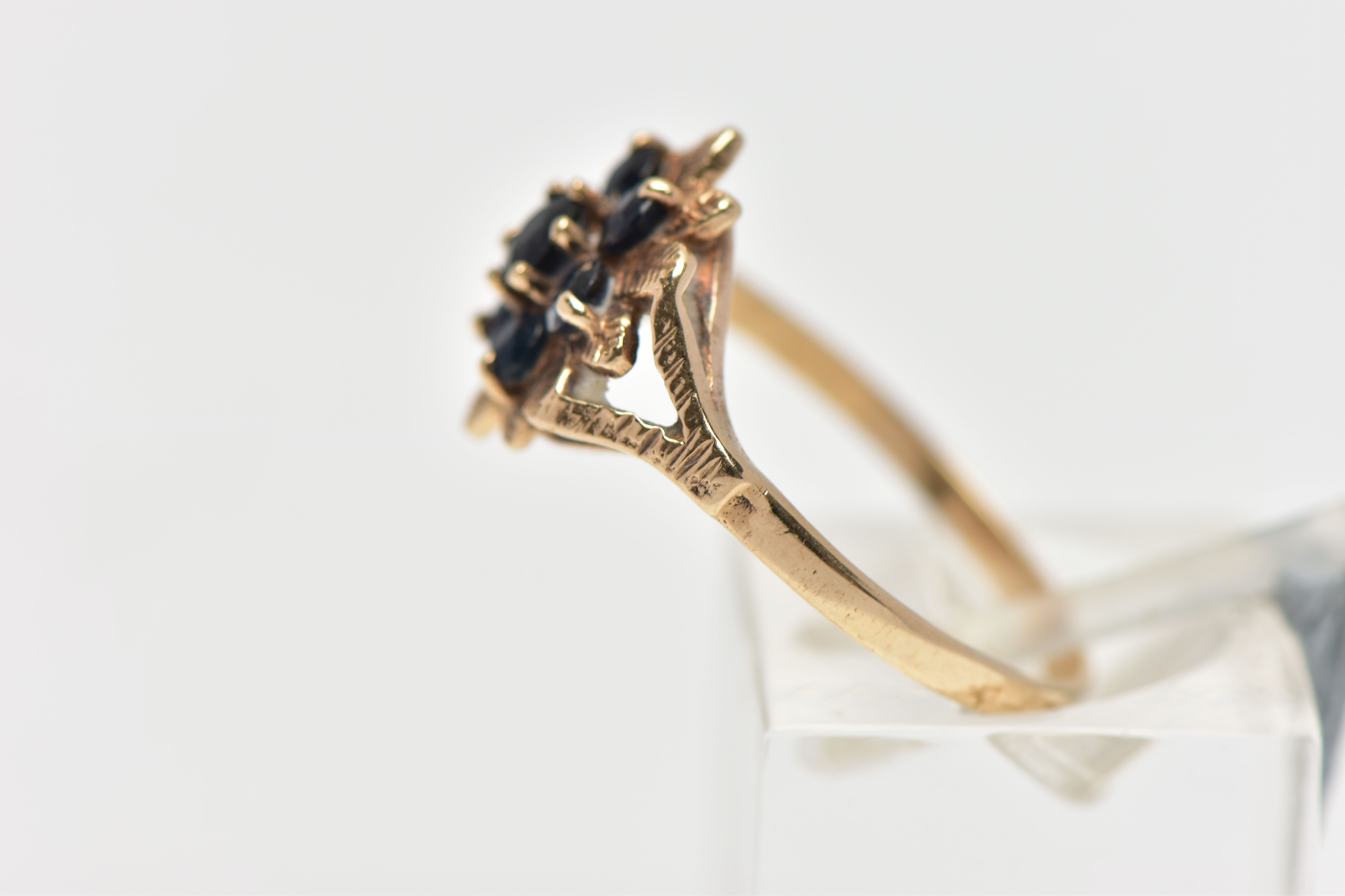 A 9CT GOLD SAPPHIRE CLUSTER RING, flower shape cluster set with seven circular cut deep blue - Image 2 of 4