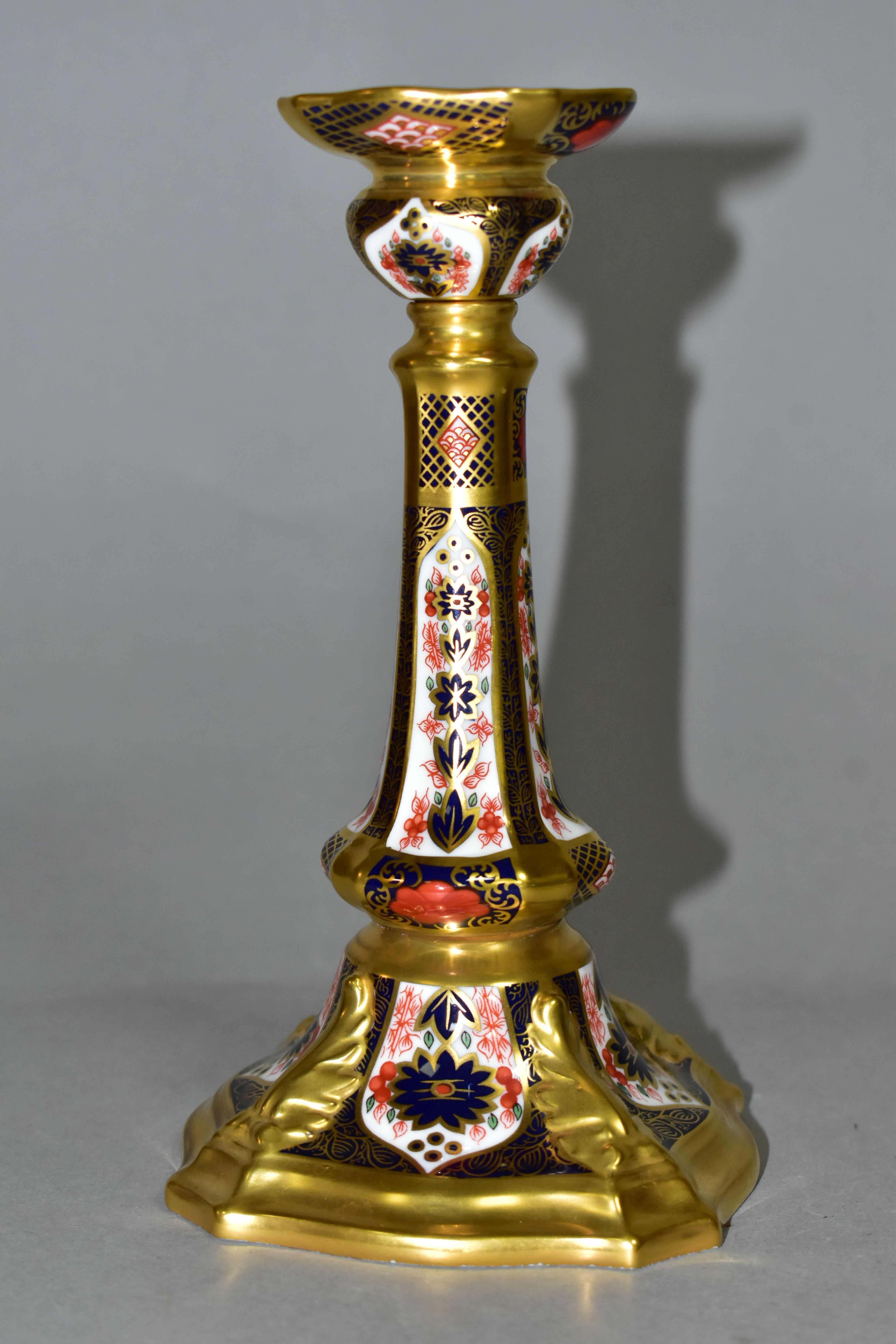 A ROYAL CROWN DERBY OLD IMARI 1128 SOLID GOLD BAND CASTLETON CANDLESTICK, heavily gilded with leaf