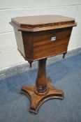 A VICTORIAN WALNUT TEAPOY, with canted corners, the shaped lid enclosing two lidded compartment (