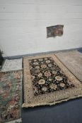A SELECTION OF RUGS, to include a cream floral rug with a central black ground, 230cm x 160cm, a