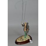 A BORDER FINE ARTS FLY FISHERMAN, model number 110, sculptor David Geenty, supported on a wooden