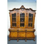 A REPRODUCTION BURR WALNUT DUTCH BOMBE DISPLAY CABINET, the top depicting foliate scrolls, three