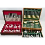 TWO CANTEENS OF CUTLERY, the first a complete 'Sheffield Cutlery' six piece set, encased in a red