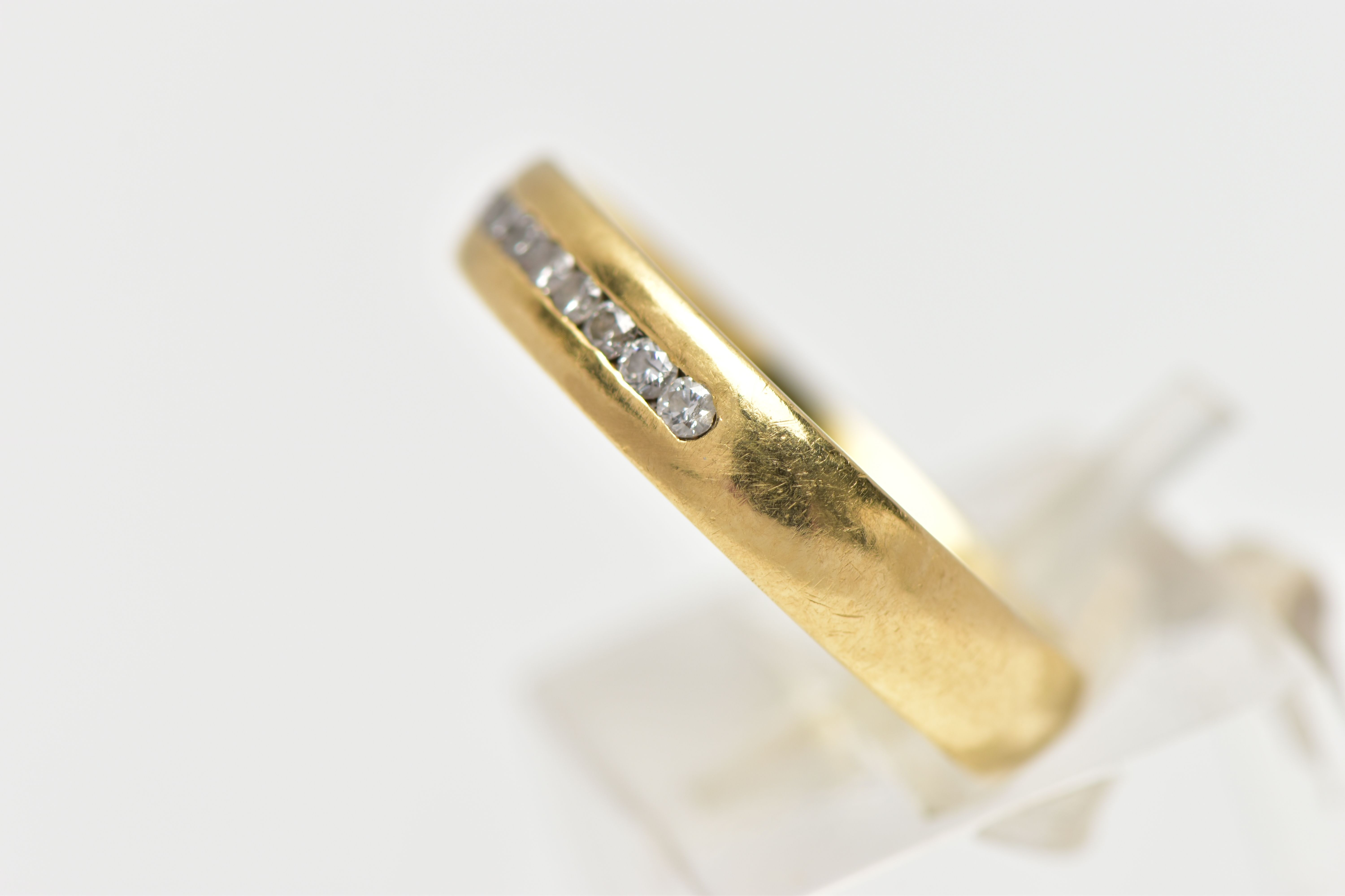 AN 18CT YELLOW GOLD DIAMOND BAND RING, set with a line of eleven round brilliant cut diamonds, - Image 2 of 4