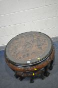 AN ORIENTAL CIRCULAR COFFEE/NEST OF TABLES, the main coffee table with a carved centre, and glass