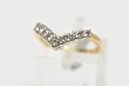 A 9CT GOLD DIAMOND NINE STONE WISH BONE RING, set with a series of nine uniform round brilliant