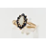A 9CT GOLD OPAL AND SAPPHIRE CLUSTER RING, the marquise opal cabochon, with circular cut sapphire