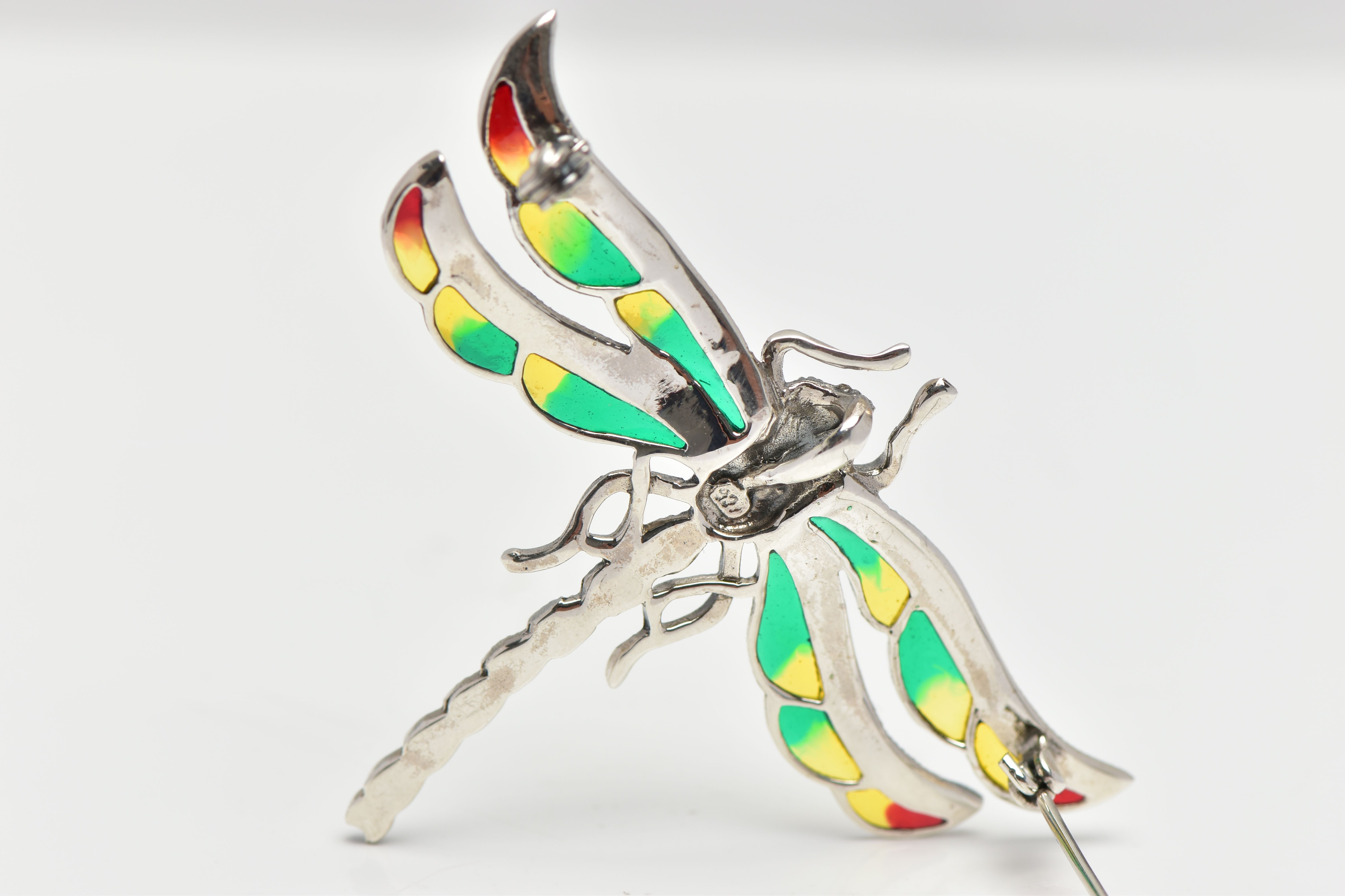 A WHITE METAL, PLIQUE A JOUR DRAGONFLY BROOCH, marcasite set body and eyes with green, yellow and - Image 2 of 2