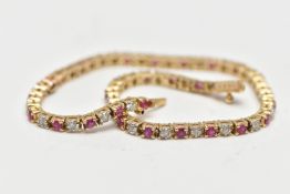 A 9CT YELLOW GOLD DIAMOND AND RUBY LINE BRACELET, set with approximately thirty one round