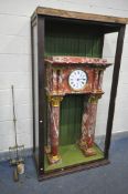 A LARGE FRENCH MARBLE CLOCK, on four cylindrical Corinthian columns, the enamel 9.5 inch dial,