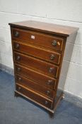 A TALL MAHOGANY AND CROSSBANDED CHEST OF SIX LONG GRADUATED DRAWERS, on bracket feet, width 61cm x