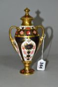 A ROYAL CROWN DERBY OLD IMARI 1128 SOLID GOLD BAND TWIN HANDLED VASE AND COVER, of slender form with