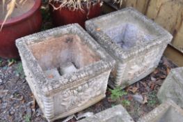 A PAIR OF MODERN COMPOSITE SQUARE GARDEN PLANTERS with foliate detail to each facet, rope edges