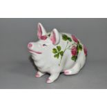 AN EXON WEMYSS PIG, painted with pink clover by Brian Adams, green painted marks to base 'Wemyss