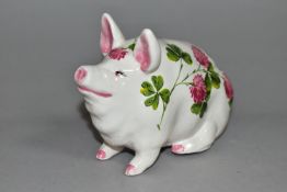 AN EXON WEMYSS PIG, painted with pink clover by Brian Adams, green painted marks to base 'Wemyss