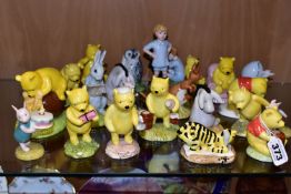 TWENTY ONE ROYAL DOULTON WINNIE THE POOH FIGURES, comprising Winnie the Pooh and the Honeypot WP1,