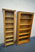 A SLIM LIGHT OAK OPEN BOOKCASE, with adjustable shelves, width 56cm x depth 24cm x height 186cm, and