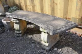 A MODERN COMPOSITE CURVED GARDEN BENCH with scrolled bases width130cm, seat depth 40cm height