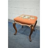 A VICTORIAN WALNUT STOOL, with a pink floral needlework fabric, on cabriole legs, 46cm x height