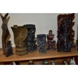 EIGHT ORIENTAL AND ASIAN CARVED WOODEN SCULPTURES, to include an intricate high relief carved panel,