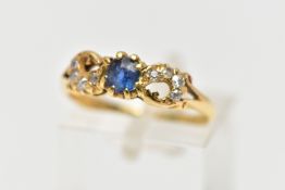 A LATE VICTORIAN 18CT GOLD SAPPHIRE AND DIAMOND DRESS RING, the oval cut sapphire claw set, with old