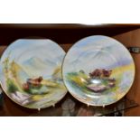 A PAIR OF PLATES HAND PAINTED WITH SCENES OF HIGHLAND CATTLE, in naturalistic Highland setting,