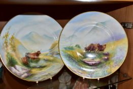 A PAIR OF PLATES HAND PAINTED WITH SCENES OF HIGHLAND CATTLE, in naturalistic Highland setting,