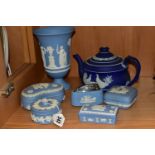 SEVEN PIECES OF WEDGWOOD JASPERWARES, comprising a mid blue dip teapot with applied doves, a pale